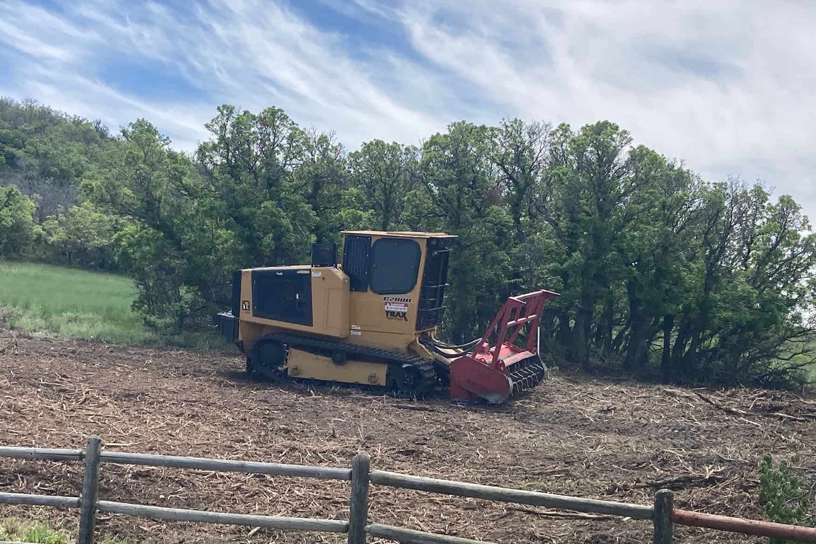 Forestry mulcher clearing Gambel oak to build defensible space around a Front Range property